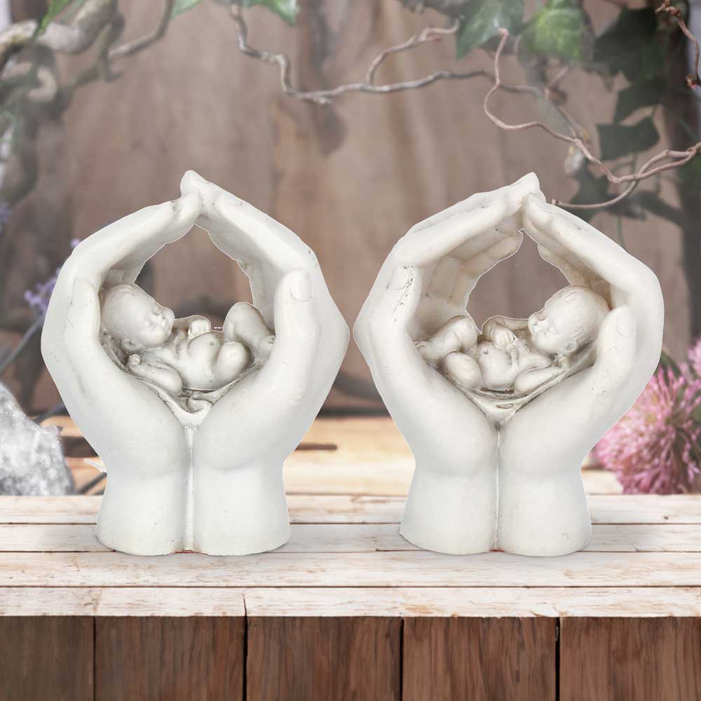 Set of Two Small Shelter 7cm Baby in Cradled Hands Figurines 7